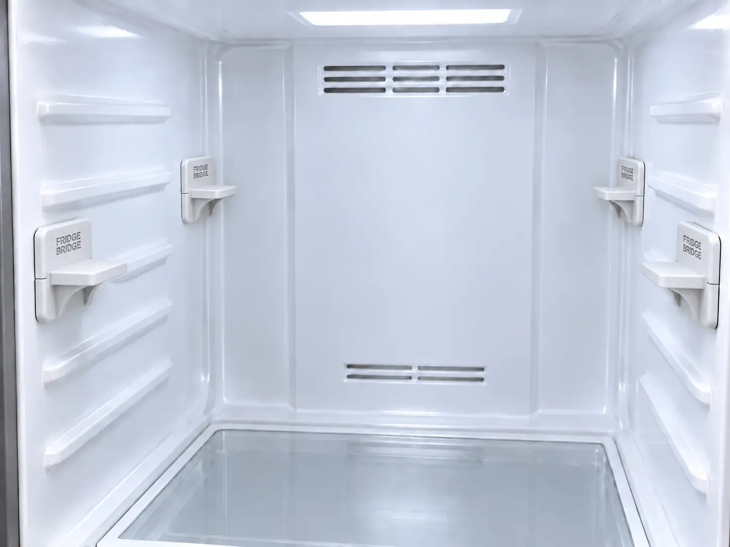 Four EVT-04A shelf supports installed at one aligned height inside an empty refrigerator, with no shelf fitted